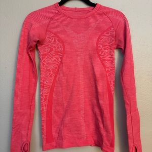 Lululemon restless pullover. Size 2. Like new. Awesome orange design